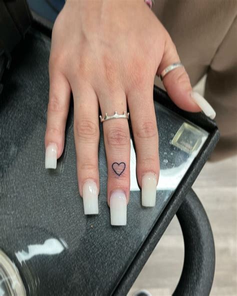 Jan 30, 2024 · 63 Heart Finger Tattoo Ideas To Adorn Your Hands. By Shannon Olivia Jan 30, 2024. Getting a heart finger tattoo on a hand is one of my favorite trends right now…. The small, subtle detail that a tiny heart design can add to an overall look is unparalleled. You can go dainty or heavy, thick or thin line, and either way it’s going to be a ... 
